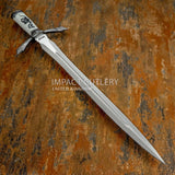 The design draws from historic oath-taking daggers and ritual blades once associated with loyalty, protection, and power.