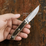 Model # 8147 "Hartwick" Custom Full Tang Skinning Knife Stag Antler placed on a hand