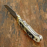 The Wild Kingdom knife blends practical craftsmanship with expressive wildlife engraving