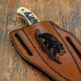 The artwork is centered along the sheath and framed by strong edge stitching that reinforces the design while maintaining a rugged outdoor aesthetic.