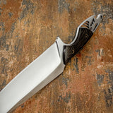 The tang itself incorporates artistic cut-outs forming a stylized mountain silhouette motif, giving the knife a distinctive skeletal design