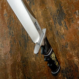 Its balanced proportions and classic clip point profile make it both a capable field knife and a striking collector’s piece.
