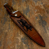 The handcrafted leather sheath continues the wilderness theme with a detailed engraving of two wild boars engaged in a dramatic encounter