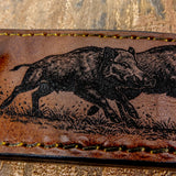 Reinforced stitching runs along the sheath’s edge, and the secure snap-retention strap keeps the knife safely in place during carry.
