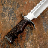 The handle is crafted from richly figured Rosewood, shaped with deep finger grooves for a secure and comfortable grip.