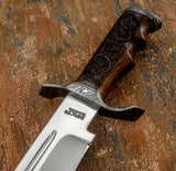 Hand Forged Damascus guard and pommel provide strength while complementing the natural grain of the wood.