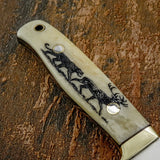 The handle is fitted with engraved camel bone scales, secured with polished brass pins and a lined lanyard hole.