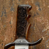 engraved Rosewood handle, Damascus fittings, and a matching engraved leather sheath, Dragonmere combines historic Bowie styling with distinctive craftsmanship.
