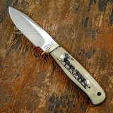 The natural tones and grain variations of the camel bone enhance the contrast of the dark engraved wildlife scene, giving the handle a distinctive and artistic character.
