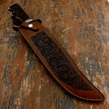 Knife inside leather sheath engraved dragon artwork