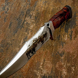 Knife with a red handle and engraved design on a textured brown background