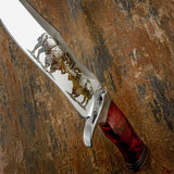 Decorative knife with red handle and engraved design on a textured brown background