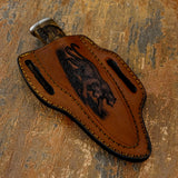 The genuine brown leather sheath continues the wildlife theme with a deeply engraved scene of a walking leopard.