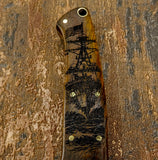 Wooden handle with Maritime ship engraving on a textured brown background, UK Knife store