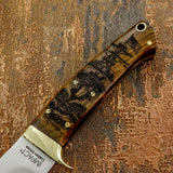 Wooden-handled knife with U.S Navy Ship engraved design on a textured brown background, UK Knife store