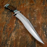 A custom fixed-blade knife with a polished silver steel blade, a dark brown wood handle, and turquoise-colored inlay accents near the bolster and pommel