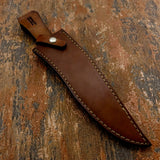 A brown Custom leather knife sheath with visible stitching and a silver snap button