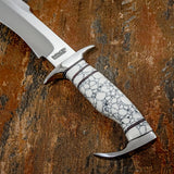 The handle is crafted from white gemstone material with distinctive black and grey veining