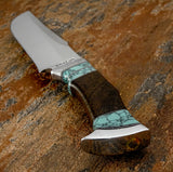 A custom fixed-blade knife with a satin-finished silver blade, a dark wood handle, and turquoise inlay, UK knife store