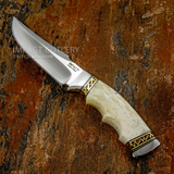 A fixed-blade "Sandstone" knife with a satin-finished D2 blade and a curved ivory bone handle, The handle is decorated with gold-toned metal bands featuring geometric patterns and filework