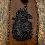 The tilted vessel appears weathered above the surface with broken structure and exposed rigging, while beneath the waterline the hull continues into an underwater scene populated by small fish, seabed stones, and marine growth.