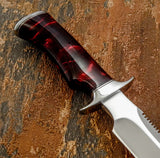 A close-up of a knife with a polished silver D2 blade and a contoured handle made of dark red and black marbled Resin, Stainless Steel Guard and But Cap, Buy from UK knife Dealer