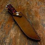 A fixed-blade knife with a reddish marbled resin handle and a brown leather sheath, Buy from UK knife store