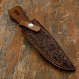 A matching scroll-patterned leather sheath completes the presentation of the Canyon Scroll Custom bowie Knife
