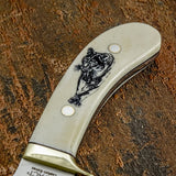 The deeply engraved camel bone handle features striking cougar imagery that reflects stealth, power, and movement