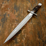 It is a striking handmade dagger that blends classic combat-style design with detailed Norse-inspired engraving.