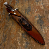 Deeply engraved leather sheath depicting Norse artwork including Vegvisir compass, ravens, Fenrir wolf, and Valknut symbol
