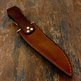The imagery complements the handle engraving and reinforces the “pack leader” theme across the full presentation.
