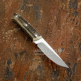 A fixed-blade knife with classic British and European sporting knives DNA, pairing traditional stag antler with a simple, purposeful blade profile