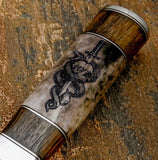 The engraving is detailed and expressive, capturing the texture of the snake’s scales and the contours of the skull with fine line work.