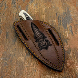 The artwork highlights the reptile’s textured hide and broad snout, giving the engraving a rugged illustrated character.
