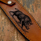 The artwork captures the animal’s bristled coat, powerful shoulders, and lowered head, emphasizing the strength and intensity associated with boar hunting.