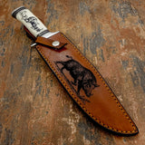 The engraving is centered along the sheath and framed by reinforced stitching that enhances durability while maintaining a rugged outdoor aesthetic.