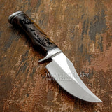 Designed for outdoor reliability while showcasing detailed wildlife artistry, this knife pairs a durable D2 tool steel blade with a beautifully engraved rosewood handle and a matching leather sheath.
