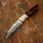 Intricately designed Folding damascus knife, decorative Jewellery grade scalloped brass bolsters, file worked brass spacers, Exotic ram horn handle. UK Knife store, UK Knife seller, UK Knife shop