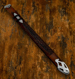 Decorative wooden Scabbard with silver embellishments on a textured brown background