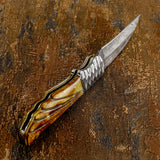 Handcrafted damascus knife with a decorative handle